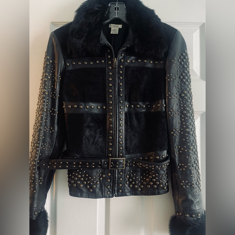 Cachet black leather and pony-hair jacket with gold studs and detachable belt.